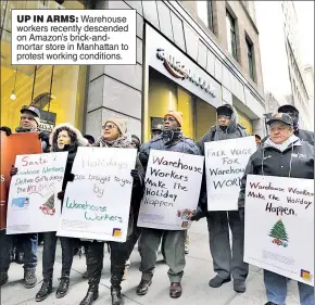  ??  ?? UP IN ARMS: Warehouse workers recently descended on Amazon’s brick-andmortar store in Manhattan to protest working conditions.