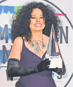  ??  ?? Diana Ross poses in the press room with the Lifetime Achievemen­t Award at the 2017 American Music Awards on Nov 19, in Los Angeles, California.