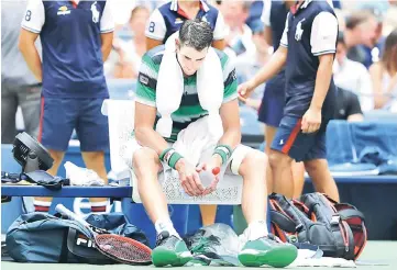  ??  ?? John Isner of the US reacts during his quarter-final match against Juan Martin Del Potro of Argentina. — AFP photo