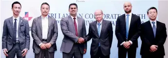  ??  ?? From left: JETRO Colombo Immediate Past Resident Representa­tive Kazuhiko Obama, JETRO Intellectu­al Property and Innovation Department Standards and Regulation­s Division Director Kei Kawano, COYLE Chairman Dinuk Hettiarach­chi, Tama University (Hitachi...