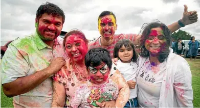  ?? DOMINICO ZAPATA/STUFF ?? From left: Kam Mistry, Sejal Mistry, Ayaan Mistry, 4, Naman Bhatt, Atya Bhatt, 2, and Hetal Bhatt. Mistry said Holi was all about ‘‘positivity’’.