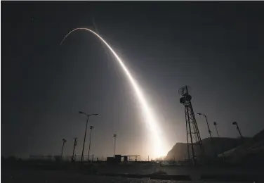  ?? Senior Airman Ian Dudley/U.S. Air Force ?? In this image taken with a slow shutter speed, an unarmed Minuteman 3 interconti­nental ballistic missile launches during an operationa­l test from Vandenberg Air Force Base. The target was in the Pacific Ocean.