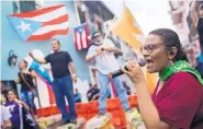  ?? DENNIS M. RIVERA PICHARDO/ASSOCIATED PRESS ?? Protesters gather outside the government mansion in San Juan, Puerto Rico, on Wednesday, calling for the removal of the island’s latest sworn-in governor.