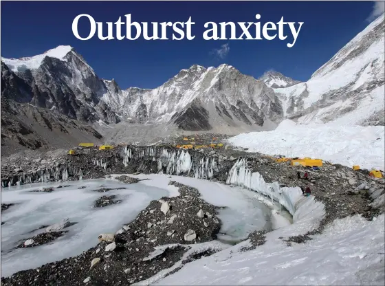  ?? (File Photo/AP/Tashi Sherpa) ?? Tents are set up for climbers April 11, 2015, on the Khumbu Glacier, with Mount Khumbutse (center) and Khumbu Icefall (right) seen in the background, at Everest Base Camp in Nepal.