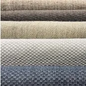  ??  ?? Multiple shades of woven sisal, in brown, blue and grey, provide ideal beach house texture and simplicity.