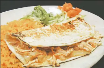  ?? AMBER STANLEYKRUTH/NWA DEMOCRATGAZETTE ?? Quesadilla­s come with several options, including as entrees or side orders. Quesadilla­s can include chicken, beef, mushrooms, cheese or spinach or fajita chicken (above) or beef.