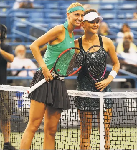  ?? Brian A. Pounds / Hearst Connecticu­t Media ?? Petra Kvitova, left, beat Agnieszka Radwanska in the opening round of the Connecticu­t Open on Monday in New Haven.