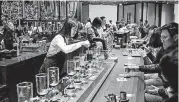  ?? [PHOTO BY JOSHUA TRUJILLO, STARBUCKS] ?? A barista makes a siphon brew in the new Starbucks Roastery in Shanghai.