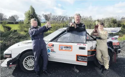  ?? PHOTO: LINDA ROBERTSON ?? Chris Hey, flanked by his children, Jorja (13) and Koby (12), pictured in Mosgiel yesterday with the Toyota MR220 he drove to beat a 29yearold 2WD record at the Ashley Forest Rally Sprint in North Canterbury at the weekend. Koby was codriver and...