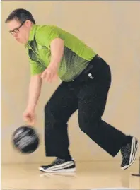  ?? JASON SIMMONDS/JOURNAL PIONEER ?? Team P.E.I.’s Paul Phillips of Summerside releases the ball during the team competitio­n of the Special Olympics Canada 2018 bowling championsh­ips at Credit Union Place on Tuesday. Team P.E.I. won a bronze medal.