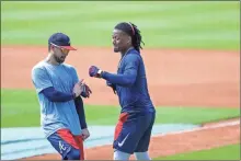  ?? aP-Brynn anderson ?? Atlanta Braves’ Ronald Acuña Jr., right, and Ender Inciarte, left, horseplay during team practice at Truist Park in Atlanta on July 5.