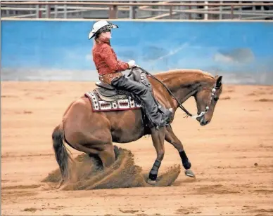  ?? Contribute­d ?? Nag Horse Ranch owner Sue Gray riding in a reining event. She and her husband Norman Gray travel to shows together.