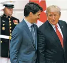  ?? EVAN VUCCI/THE ASSOCIATED PRESS ?? President Donald Trump talks Wednesday with Canadian Prime Minister Justin Trudeau after he arrived at the White House.