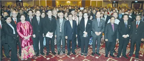  ??  ?? Shafie (sixth from right) and members of the State Cabinet with recipients of State Government financial aid at the State Legislativ­e building yesterday.