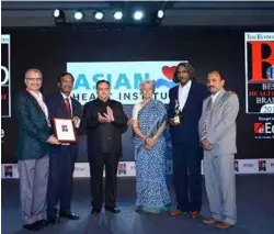  ??  ?? DR. PRADYOTH RATH OF ASIAN HEART INSTITUTE MUMBAI RECEIVES THE BEST HOSPITAL AWARD FROM DR. JAGDISH PRASAD, HEALTH MINISTER JP NADDA AND DR SOWMYA SWAMINATHA­N, ALONG WITH DR VIJAY DSILVA, DR SANTOSH KUMAR DORA, ALSO OF ASIAN HEART INSTITUTE.