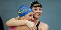  ?? BW MEDIA ?? Lauren Boyle, right, celebrates with Emma Robinson after swimming qualifying times for Rio.