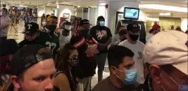  ?? Andrew Schilinski ?? Visitors wait in a line during a lockdown Monday at the Flamingo. Guest Andrew Schilinski said police were blocking the elevator bays to prevent people from going upstairs from just after 11 p.m. until 2:30 a.m. the next morning.