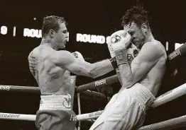  ?? Ed Mulholland / Getty Images ?? Despite giving up 7 inches in height and 8inches in reach, Canelo Alvarez, left, dominated Callum Smith late Saturday night in the Alamodome.