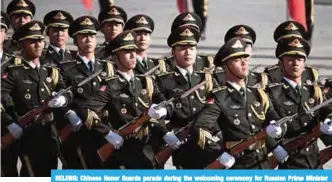  ??  ?? BEIJING: Chinese Honor Guards parade during the welcoming ceremony for Russian Prime Minister Dmitry Medvedev and Chinese Premier Li Keqiang at the Great Hall of the People yesterday. —AFP