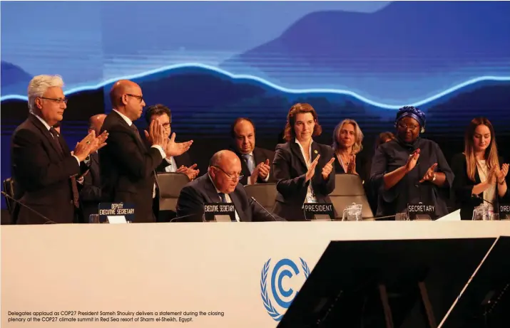  ?? Delegates applaud as COP27 President Sameh Shoukry delivers a statement during the closing plenary at the COP27 climate summit in Red Sea resort of Sharm el-Sheikh, Egypt. ??