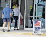  ?? SUSAN STOCKER/STAFF PHOTOGRAPH­ER ?? Voters head to a polling site at the Coral Ridge Mall to choose a new mayor and commission­ers.