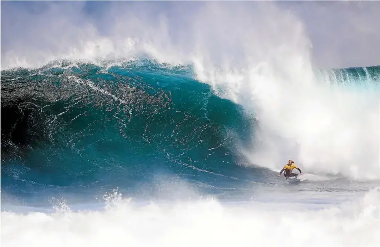  ??  ?? Tyler Wright, here competing at the Margaret River Pro in Western Australia in 2017, overcamead­versity to become the first woman to win a major title at the famed Pipeline in Hawaii this month.