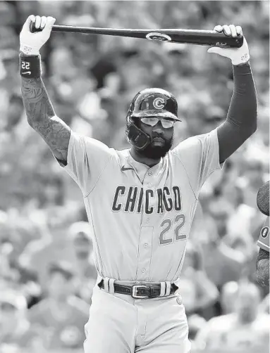  ??  ?? Cubs right fielder Jason Heyward heads back to the dugout after striking out with the bases loaded in the first inning against the Reds at Great American Ball Park in Cincinnati. The Reds won 3-2, handing the Cubs their eighth consecutiv­e loss.