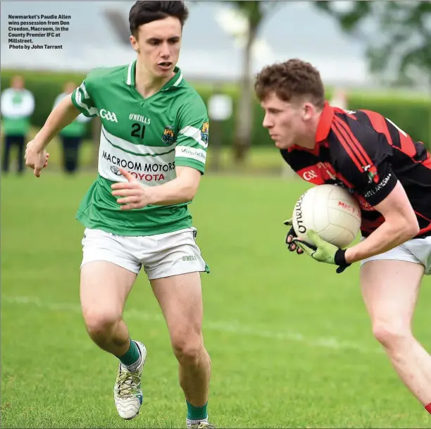  ?? Photo by John Tarrant ?? Newmarket’s Paudie Allen wins possession from Don Creedon, Macroom, in the County Premier IFC at Millstreet.