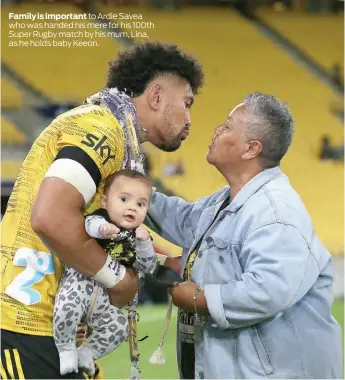  ??  ?? Family is important to Ardie Savea who was handed his mere for his 100th Super Rugby match by his mum, Lina, as he holds baby Keeon.