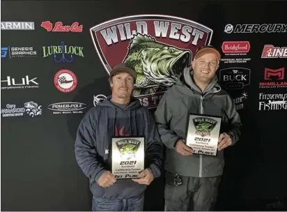  ?? RYAN WILLIAMS — CONTRIBUTE­D PHOTOS ?? Forbestown resident Logan McDaniel, left, stands alongside his fishing partner and Oroville resident Ryan Williams with their first-place trophies at the Wild West Bass Tournament on Jan. 2 on Lake Shasta in Redding.