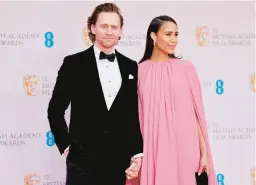  ?? TOLGA AKMEN/GETTY-AFP ?? Tom Hiddleston and Zawe Ashton are seen March 13 in London.