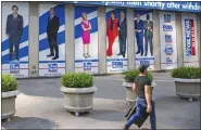  ?? AP PHOTO/ TED SHAFFREY, FILE ?? Images of Fox News personalit­ies, from left, Tucker Carlson, Sean Hannity, Laura Ingraham, Maria Bartiromo, Stuart Varney, Neil Cavuto and Charles Payne appear outside News Corporatio­n headquarte­rs in New York on July 31, 2021.