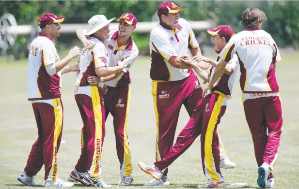  ?? Picture: STEWART McLEAN ?? TRIUMPH: Atherton players celebrate the wicket of Brenton Edwards on their way to victory in the 40-over grand final.