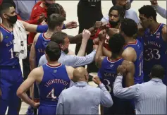  ?? KATHY BATTEN - THE ASSOCAITED PRESS ?? Kansas coach Bill Self meets with players during the second half of an NCAA college basketball game against West Virginia, Saturday, Feb. 6, 2021, in Morgantown, W.Va.