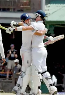  ??  ?? English batsmen Alastier Cook and Kevin Piertersen hug each other after beating Sri Lanka by eight wickets and also winning their first winter test this season. (Pix Ranjith Perera)