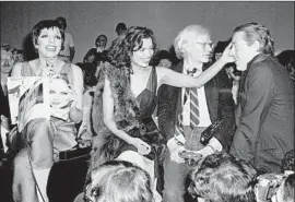  ?? Adam Scull Zeitgeist Films / Kino Lorber ?? LIZA MINNELLI, from left, Bianca Jagger, Andy Warhol and fashion designer Halston were among Studio 54’s famous visitors in the Manhattan club’s heyday.