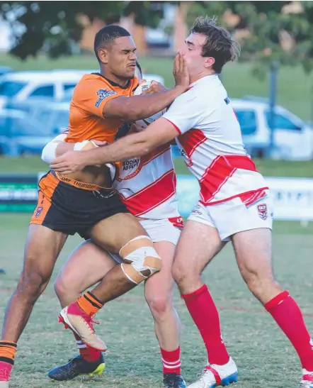  ?? Picture: MIKE BATTERHAM ?? Southport Tigers’ Lee Turner is stopped by the Currumbin Eagles defence.