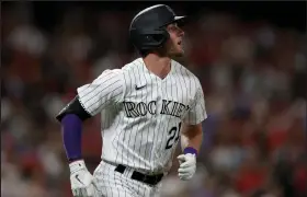  ?? Matthew Stockman / Getty Images North America ?? Ryan McMahon (24) of the Colorado Rockies circles the bases after hitting a two RBI home run against the St. Louis Cardinals in the seventh inning at Coors Field on Aug. 9, 2022.