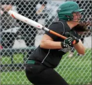  ?? RANDY MEYERS — THE MORNING JOURNAL ?? Meghan Allegretto of Elyria Catholic delivers a hit to center field against Rocky River.