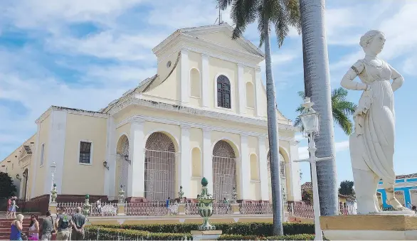  ??  ?? The Church of the Holy Trinity overlooks the main square in the quaint colonial town of Trinidad, Cuba. PHOTOS: TRISH FEASTER