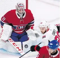  ?? GRAHAM HUGHES/ THE CANADIAN PRESS ?? Montreal Canadiens goaltender Carey Price keeps his eyes on the puck as Ottawa Senators’ Paul Carey moves in during second period NHL pre-season hockey action in Montreal.