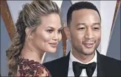  ?? Paul Buck EPA ?? CHRISSY TEIGEN, here at the 2016 Oscars with husband John Legend, shared her miscarriag­e news.