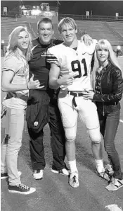  ?? COURTESY OF WINTER FAMILY ?? Donovan Winter is shown after a game with older brother, Cordell, left, father, Blaise and mother, Angie.