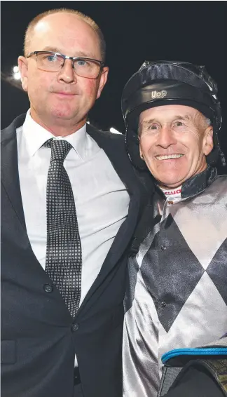  ?? Picture: GETTY IMAGES ?? Trainer Toby Edmonds and Jeff Lloyd after a win in Melbourne.