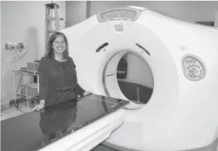  ?? CONTRIBUTE­D ?? Chelsea Soga, a radiation therapist supervisor at the P.E.I. Cancer Treatment Centre, is shown with the current CT simulator. The Queen Elizabeth Hospital Foundation is hosting a fundraiser on Tuesday, June 2, to raise the balance of what is needed for a new machine.