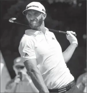  ?? The Associated Press ?? ONE TO CATCH: Dustin Johnson, winner Sunday of the PGA Tour’s first playoff event, prepares to tee off in the Dell Technologi­es Classic Friday in Norton, Mass. Coming off his first victory in five months, Johnson led the field with a 5-under 66.