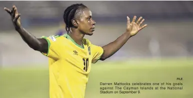  ?? FILE ?? Darren Mattocks celebrates one of his goals against The Cayman Islands at the National Stadium on September 9.