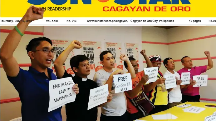  ?? (PJ ORIAS) ?? ENRAGED. Some of the ‘Gen San 13’, together with church workers from the Iglesia Filipina Indepentie­nte (IFI), raise their fists in protest of their arrest in General Santos City last July 4. The church workers and human rights advocates were attending a seminar when they were arrested by police for obstructio­n of justice.