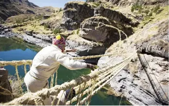  ??  ?? Rope suspension bridges were pioneered in mountain regions long before being re-invented in the West. A simple bridge consists of four ropes linked by planks at the bottom and with rope between top and bottom.