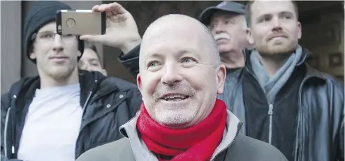  ?? KEVIN VAN PAASSEN FOR NATIONAL POST ?? Gregory Alan Elliott leaves Old City Hall courts after being found not guilty of criminal harassment via Twitter.
Elliott was charged with harassing two feminist activists by communicat­ing with them on the online service.